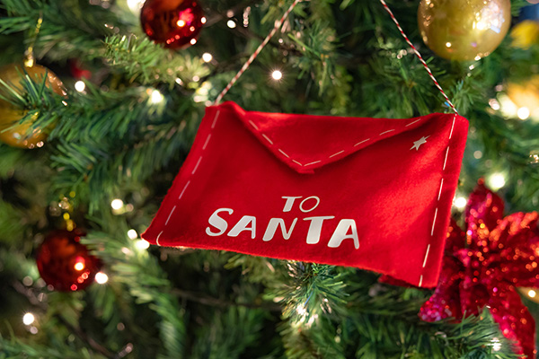 Santa envelope ornament on tree