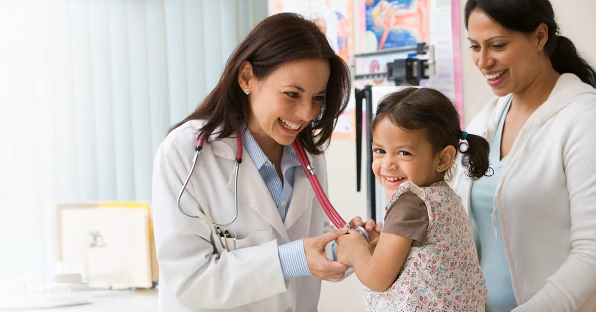 doctor examining a child