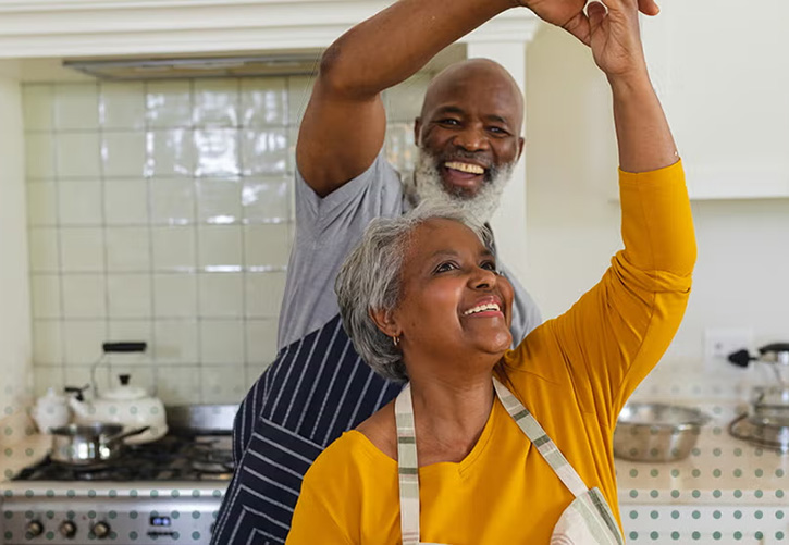 Couple dances in kitchen