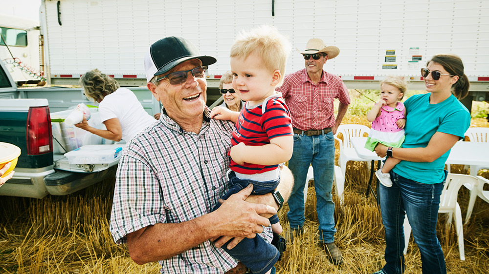 grandfather holding grandson
